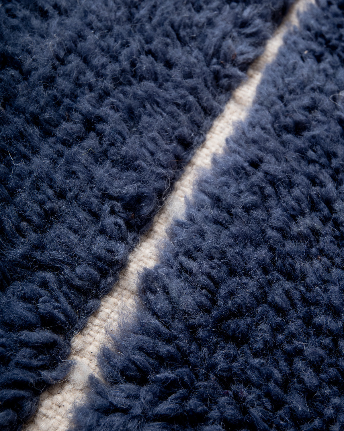 Modern, designer, handcrafted Berber rug from Morocco. Beniourain carpet with beautiful colours and patterns and fluffy wool texture.